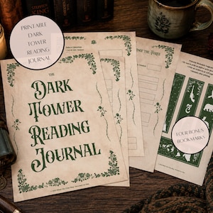 May include: A printable Dark Tower reading journal featuring cream-colored pages with dark green floral borders and text. The journal includes sections for reader notes and a separate sheet with four bonus bookmarks displaying green graphic icons.