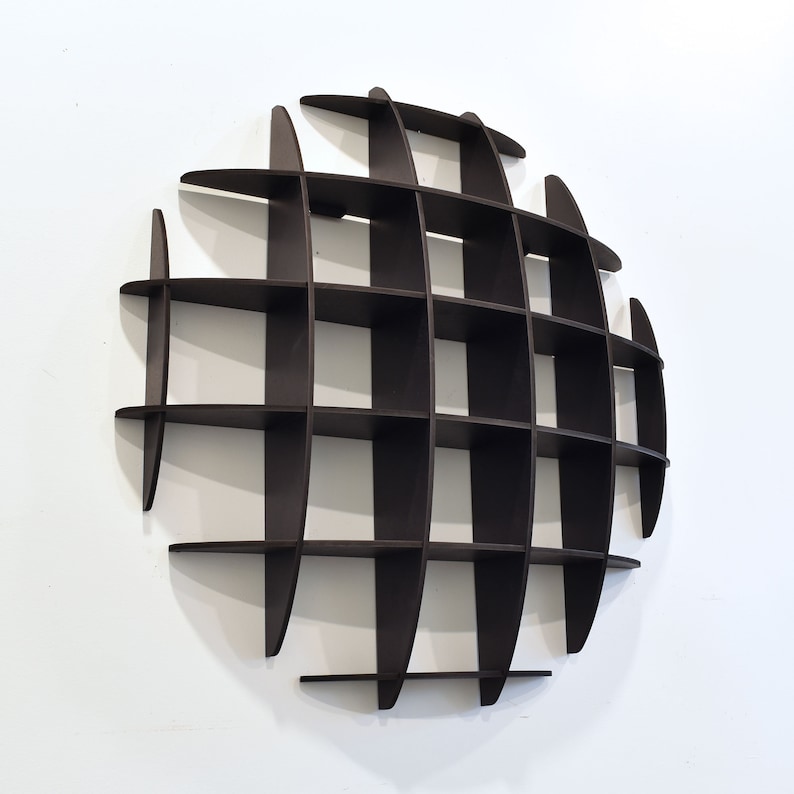 May include: A dark brown, circular wall shelf with a grid pattern. The shelf is made of wood and has a modern design.