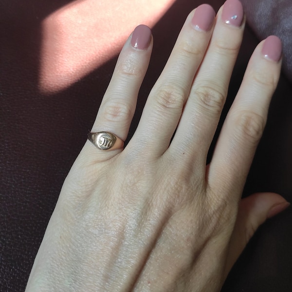 Little golden ring with M letter