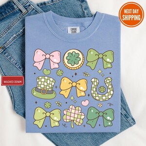 a t - shirt with a picture of a bow tie and shamrocks on it