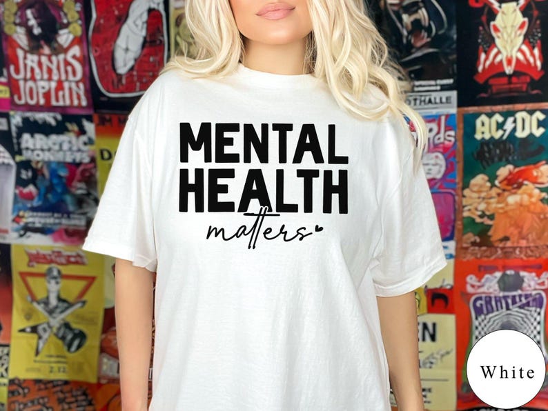a woman wearing a white shirt with the words mental health matters printed on it
