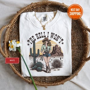 a white t - shirt with a picture of a woman on it