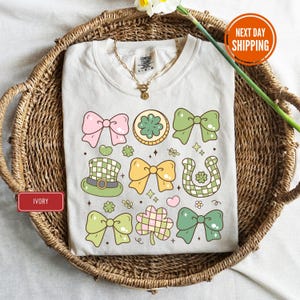 a t - shirt with bows and shamrocks on it