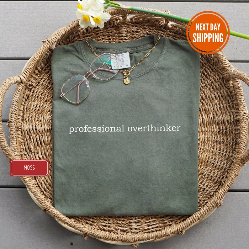 a shirt that says professional overthinker on it
