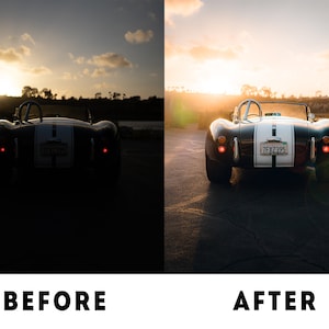 May include: A black vintage car with a white stripe down the centre is parked on a tarmac road. The car has a number plate that reads "7FXZ395". The sun is setting in the background, casting a warm glow on the scene.