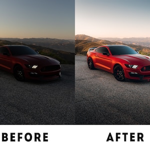 May include: A red Ford Mustang sports car parked on a tarmac road with a mountain range in the background. The car is facing the camera and the sun is setting in the distance.