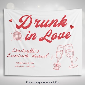 May include: White banner with red text that reads "Drunk in Love" with a disco ball and two champagne flutes. Below the text is "Charlotte's Bachelorette Weekend!" with the date and location "NASHVILLE, TN 08.09.24 - 08.11.24". The bottom of the banner reads "CherrySunsetCo."