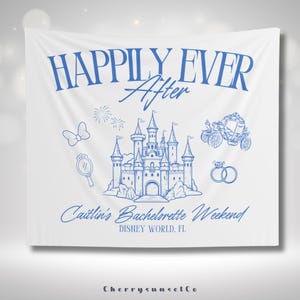 May include: A white banner with blue text and illustrations. The text reads "Happily Ever After" and "Caitlin's Bachelorette Weekend, Disney World, FL". The banner features a blue illustration of a castle, a carriage, a bow, a mirror, and two rings.