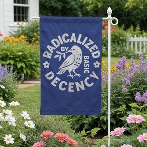 May include: A white ceramic mug with a black handle and the text "But First, Coffee" in a bold, black font. The mug is set against a blurred background, highlighting its clean design.