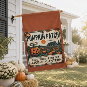 May include: A rectangular rust-colored garden flag featuring a vintage-style sign graphic that reads THE PUMPKIN PATCH and PICK YOUR PERFECT JACK-O-LANTERN, with an illustration of a large carved pumpkin in the foreground and a field of pumpkins.