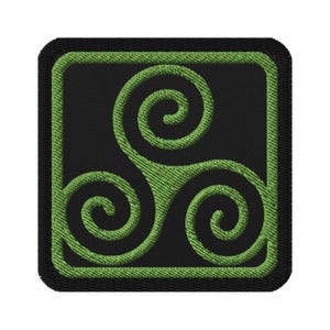 May include: Embroidered patch featuring a green triskele design on a black square background. The triskele, a Celtic symbol, is composed of three spiraling arms. The patch has a black border and green stitching, suitable for clothing or accessories.