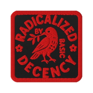 May include: Embroidered patch with a red border and a black center. The patch features a red bird holding a sprig and the words "RADICALIZED BY BASIC DECENCY" in red, with a small flower on each side.