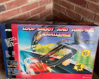 Vintage Artin loop shoot and jumping challenge slot car set