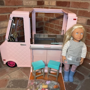 Large Our Generation ice cream van in pink with accessories and doll