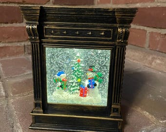 lighted water lantern Christmas scene snow globe