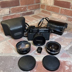 Vintage yashica rangefinder rare all black model GT with original yashica aux telephoto wide angle lens kit