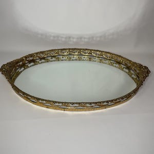 Vintage Hollywood Regency gold-tone oval dresser mirror, vanity tray or mirror tray.