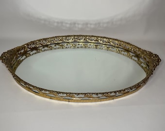Vintage Hollywood Regency gold-tone oval dresser mirror, vanity tray or mirror tray.