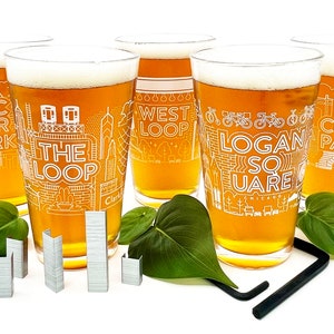 May include: Set of five clear glass beer mugs with white outlines of Chicago neighborhoods, including Wicker Park, The Loop, West Loop, Logan Square, and Lincoln Park.