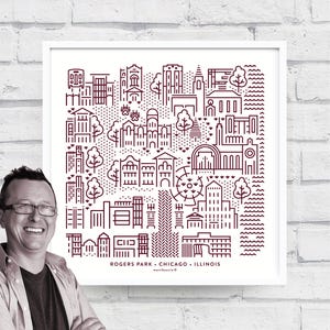 May include: A framed print featuring a minimalist line drawing of Rogers Park, Chicago, Illinois. The artwork is in a dark burgundy color and includes buildings, trees, and the text "ROGERS PARK • CHICAGO • ILLINOIS". The print is in a white frame.