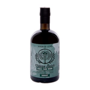 May include: A dark glass bottle of Village Batch single farm origin extra virgin olive oil with a black cap. The label is light green with a dark green olive tree illustration, text reading Koroneiki Olive, and the word Robust in a box.