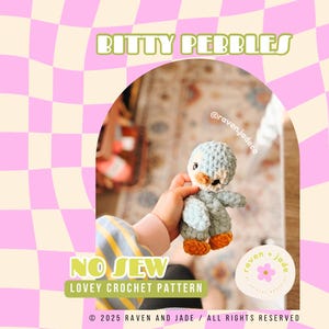 May include: A crocheted penguin toy in light blue with orange feet and a black beak. The toy is being held by a hand in a striped shirt. The image has the text "Bitty Pebbles", "No Sew", "Lovey Crochet Pattern", "@raven.jadeco", "raven + jade", and "2025 Raven and Jade / All Rights Reserved".