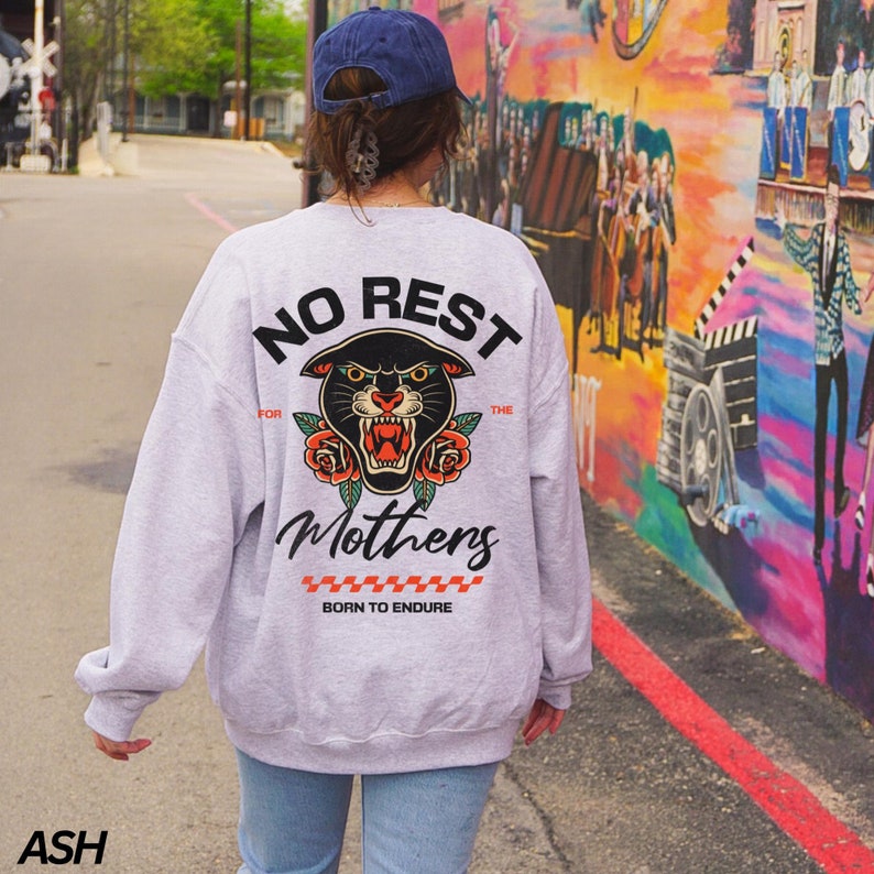 May include: A gray sweatshirt with a black panther graphic and the text "No Rest For The Mothers Born To Endure".