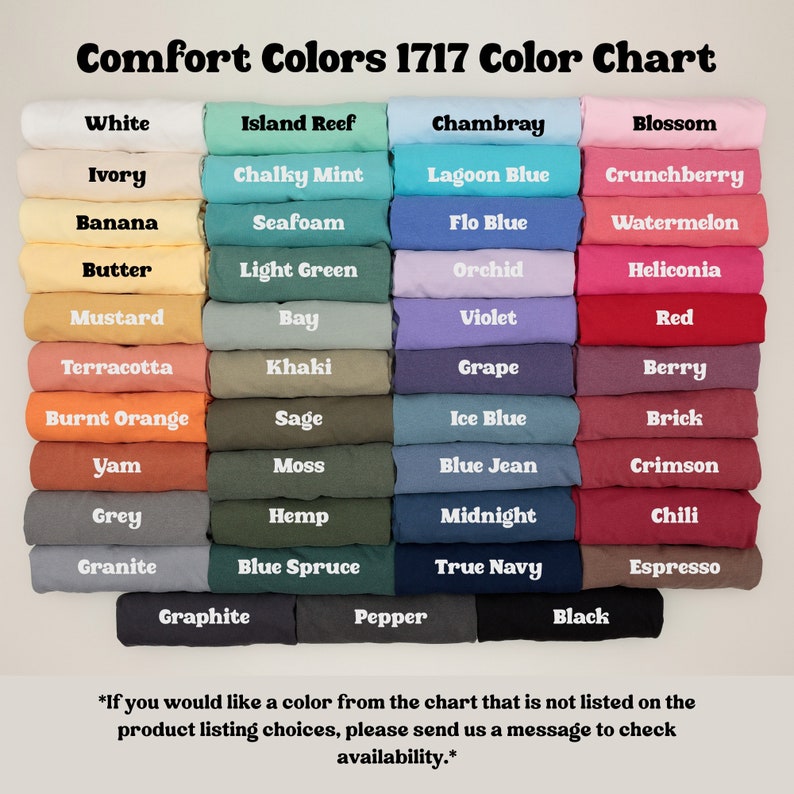 May include: Color chart featuring a variety of Comfort Colors 1717. The chart displays a spectrum of colors, including white, pink, blue, green, and brown. Each color is labeled with its name, such as "Blossom," "Chambray," and "Black."