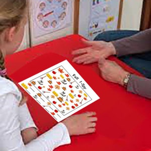 May include: A white sheet of paper with a fall-themed I Spy game. The paper has a red border and is filled with small images of fall leaves, pumpkins, apples, and other fall-related items. The text "Fall I-Spy" is printed in black at the top of the paper.