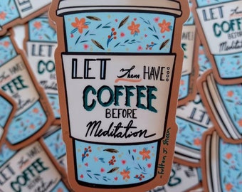 May include: A sticker with a blue and white coffee cup with a floral design. The text on the sticker reads "Let them have coffee before meditation."