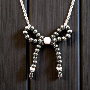 18” Adjustable Pink Conch Bow Necklace in Sterling Silver. Navajo Pearl and Pink Conch Bow Necklace. Southwestern Bow Bead Necklace.