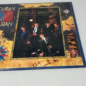 Duran Duran signed Seven and the Ragged Tiger Album JSA COA