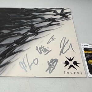 Erra signerade Cure Album JSA COA