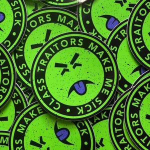 May include: A circular sticker with a bright lime green background and black speckled texture. The design features a central face with squinting eyes and a purple tongue sticking out. The text "CLASS TRAITORS MAKE ME SICK" is printed in black capital letters along the circular border.