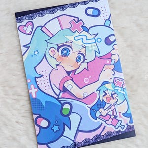 May include: A rectangular print featuring a colorful anime-style illustration of a nurse character with light blue hair and a pink uniform. The character appears distressed with tears in their eyes, surrounded by medical icons like syringes and pills.