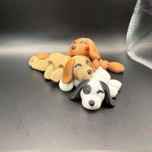 May include: A white ceramic mug with a black handle and the text "But First, Coffee" in a black, bold font. The mug is on a white surface.