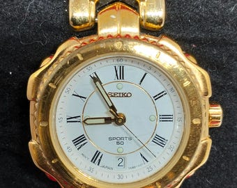 Vintage Seiko Sports 7N82-0479 Ladies watch Golden Tone Stainless steel Date 1980&#39;s Japan Quartz Water resistant