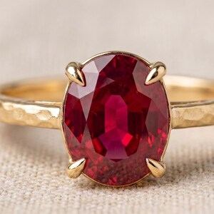Natural Ruby Panchtatu Gold Plated Oval Cut Prong Hammered Solitaire Ring