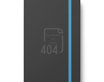 May include: A black notebook with a blue ribbon bookmark. The front cover has a gray graphic of a document with the text "motivation not found 404".