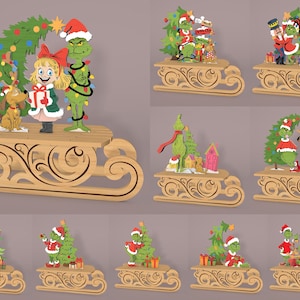 May include: Wooden Christmas decorations featuring characters and scenes from a holiday story. The decorations include a green character, a girl, a dog, and a Christmas tree, all on a wooden sleigh. The decorations are painted in bright colors.