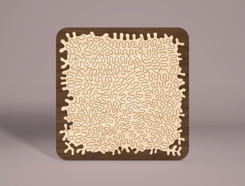 May include: A wooden jigsaw puzzle with a brown frame and a light wood interior. The puzzle features a complex, intricate design of swirling, organic shapes.