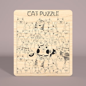 May include: A wooden puzzle featuring a black and white illustration of a group of cats with the text "CAT PUZZLE" at the top.