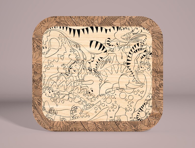 May include: A wooden coaster with a black and white line drawing of various dinosaurs surrounded by a leafy border.
