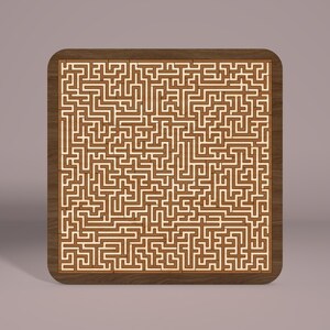 May include: A wooden maze puzzle with a brown frame and a white intricate maze design.