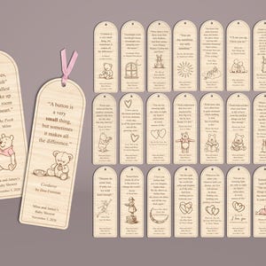 May include: A collection of wooden bookmarks with quotes and illustrations. The bookmarks feature quotes from Winnie the Pooh and other authors, with images of bears, rabbits, and hearts. Each bookmark has a pink ribbon.