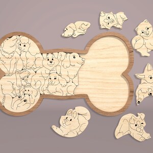 May include: A wooden puzzle shaped like a bone with a cutout in the middle. The puzzle pieces are various cartoon dogs in different poses. The puzzle is made of natural wood and has a light brown color.