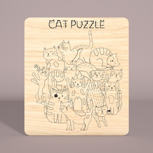 May include: A wooden puzzle featuring a black and white line drawing of a group of cats. The puzzle is titled "CAT PUZZLE".
