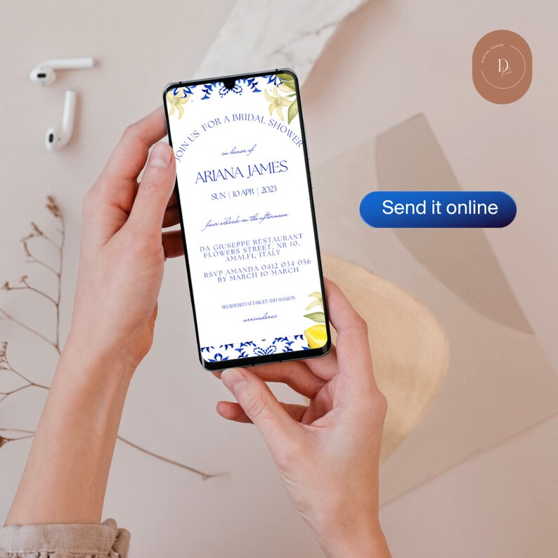 May include: A blue and white floral design wedding invitation on a smartphone screen. The invitation is for a bridal shower for Ariana James on Sunday, April 10, 2023, at Da Giuseppe Restaurant in Amalfi, Italy. The RSVP information is included with a deadline of March 10, 2023.