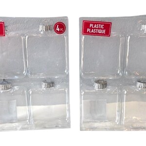 May include: Two sets of clear plastic Christmas baubles, each containing four baubles. Each set is packaged in a clear plastic tray with a red label that reads "PLASTIC PLASTIQUE". The baubles have silver caps.