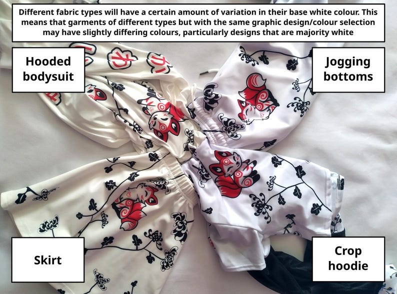 Puede incluir: Se muestran un body con capucha, pantalones de jogging, una falda y una sudadera corta blancos. Cada prenda presenta un patr&oacute;n repetido de una criatura parecida a un zorro rojo y blanco y detalles florales negros. El texto explica las variaciones de color.